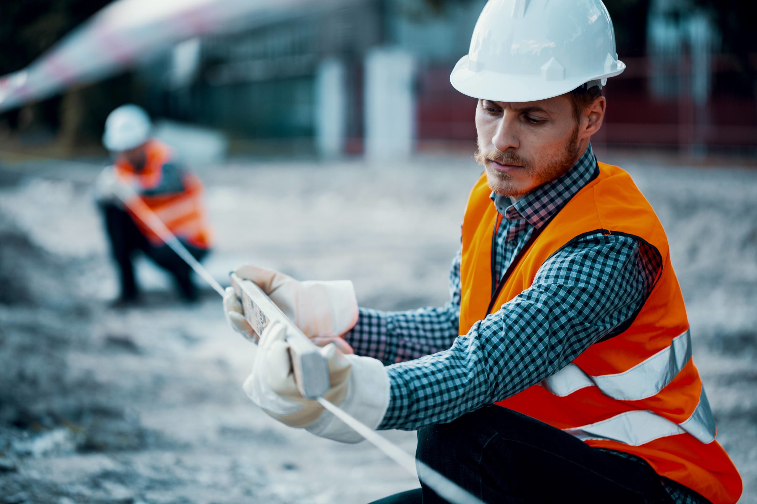 Worker,In,Orange,Uniform,And,White,Helmet.,Safety,During,Roadworks